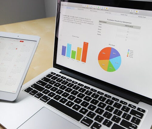 a laptop screen showing analytics, one of Pearl's marketing services
