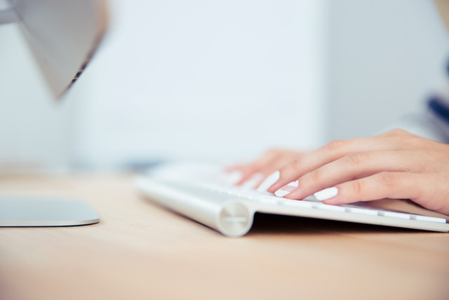 female hands using keyboard